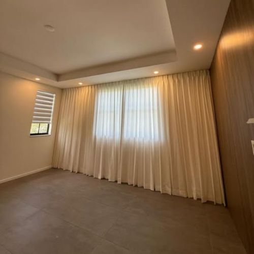 Cream pleated curtains in Al Quoz